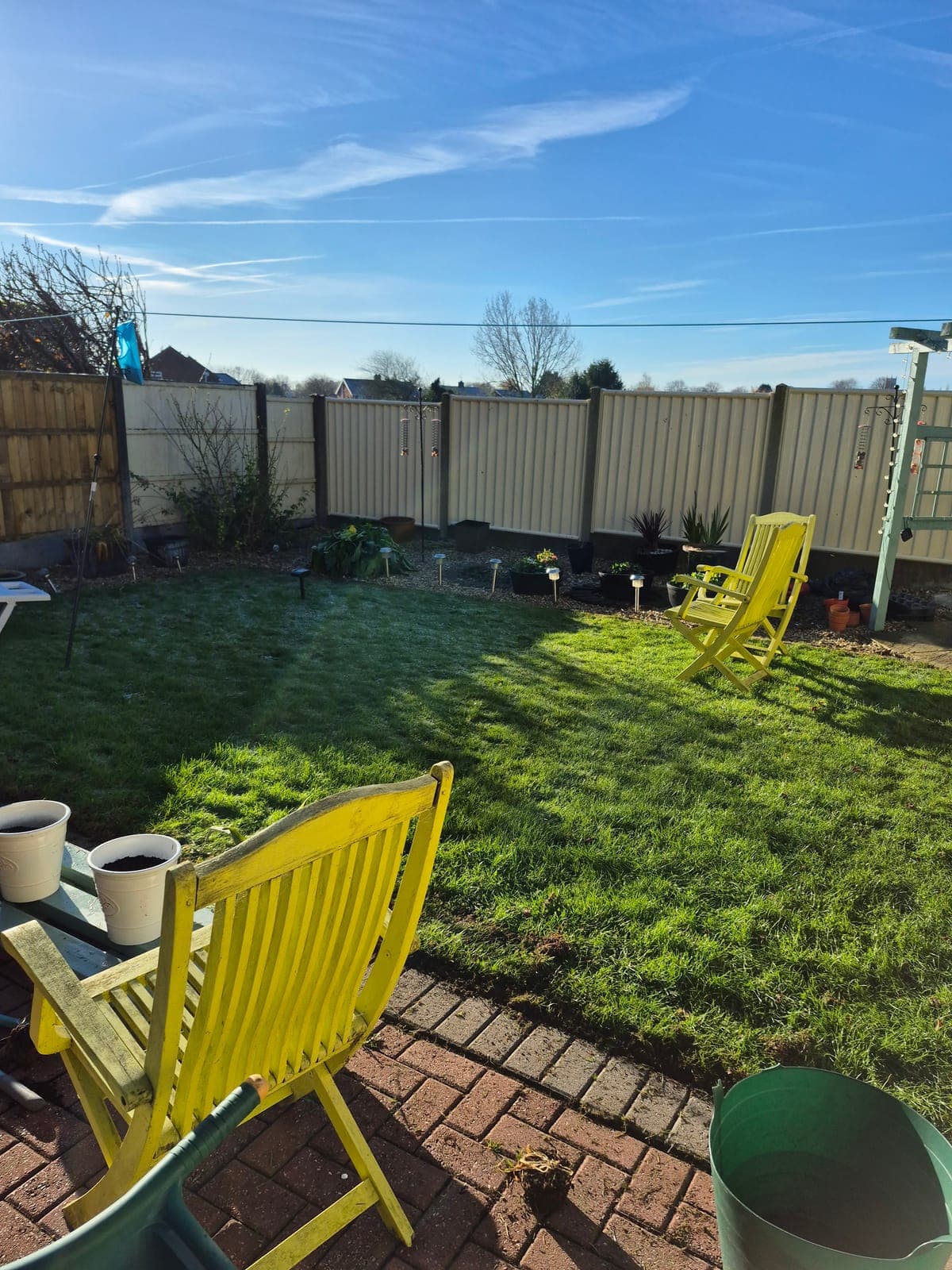 A gardener working carefully in a well-kept garden