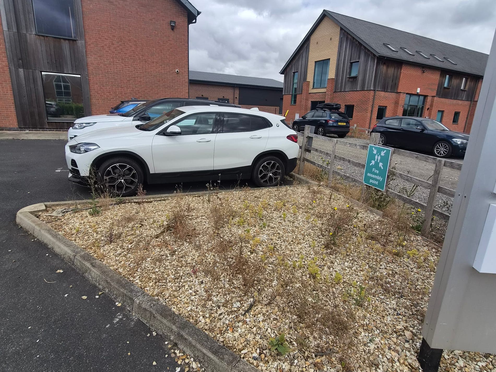 Car park gravel beds weeded, business premises near Welton before Spade & Blade sorted it